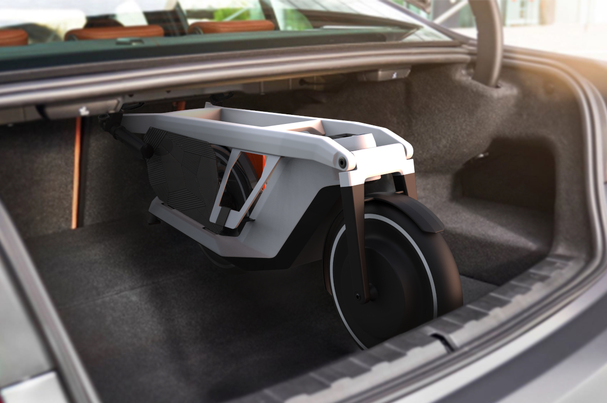 El patinete eléctric BMW Clever Commute cabe plegado en el maletero de un coche